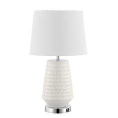 a white table lamp with a white shade on the base and a silver metal base