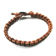 This bold and striking 11mm-wide bracelet is crafted from ultra-stylish macrame leather with an earth-coloured hue. Securely fastened with a tree of life button loop closure, it's a perfect fit for those with a 9-inch wrist. Large and sturdy, this rustic-looking piece is sure to make a statement! Large bracelet for men Earth Colored 2 mm authentic leather cord Features macrame braid Unique one of a kind look Rustic yet elegant Tree of Life Button Closure Wear it on many occasions The width of th Adjustable Brown Braided Bracelet For Everyday Use, Brown Bohemian Leather Bracelet For Everyday, Brown Bohemian Leather Bracelet For Everyday Use, Bohemian Brown Leather Bracelet For Everyday Use, Casual Brown Braided Leather Bracelet, Casual Leather Bracelet With Adjustable Cord, Casual Brown Leather Braided Bracelets, Casual Brown Leather Braided Bracelet, Bohemian Brown Leather Bracelet With Sliding Knot