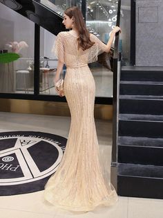 Elegant Champagne Mermaid Dress With Sweep Train, Elegant Champagne Gown For Prom, Elegant Champagne Gown With Mermaid Hem, Elegant Champagne Floor-length Evening Dress, Elegant Sequined Prom Dress, Elegant Champagne Gown For Party, Elegant Champagne Maxi Length Gown, Dressy Embellished Evening Dress, Elegant Party Gown With Sequins