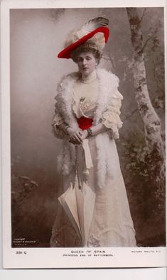 an old fashion photo of a woman wearing a red hat and white dress with feathers