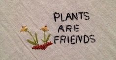 the words plants are friends written on a piece of cloth