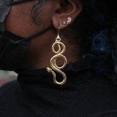 Combining three different mythologies, Egyptian, Norse, Ancient Greek, but named after Eir, the Norse Goddess of healing, it's a large statement snake coiled around itself twice, a symbol of regeneration & growth. In 18k gold plate over bronze with sapphires set into the eyes, handmade in Anna Monet's San Francisco Studios. Spiritual Metal Jewelry In Snake Shape, Spiritual Snake-shaped Metal Jewelry, Spiritual Brass Jewelry In Snake Shape, Spiritual Brass Snake-shaped Jewelry, Symbolic Snake-shaped Brass Jewelry, Symbolic Gold Snake Jewelry, Unique Brass Snake Jewelry, Snake-shaped Single Earring Jewelry Gift, Snake Shaped Single Earring For Gift