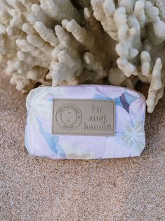 a soap bar sitting on top of a pile of sand