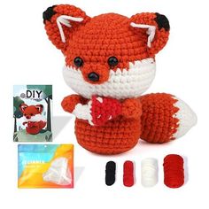 a crocheted stuffed animal is shown with yarn, scissors and other crafting supplies