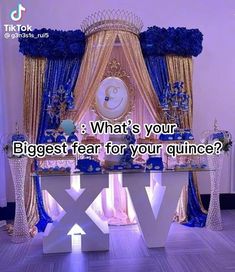 a table with blue and gold decorations on it that says, what's your biggest fear for your quince?