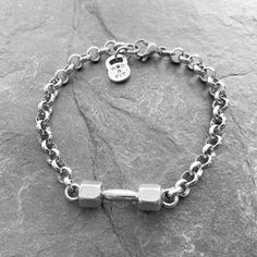 a silver bracelet with a lock on it