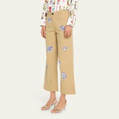 Libertine "Cecil Beaton" pants with crystal-embellished blue carnations Approx. 25" inseam Cropped fit Mid rise sits high on hip Wide legs Five-pocket style Button/zip fly; belt loops Cotton/elastane Dry clean Made in USA Floral Embroidered Pants For Spring Workwear, Spring Floral Embroidered Pants, Spring Straight Pants With Floral Embroidery, Straight Leg Pants With Floral Embroidery For Spring, Embroidered Pants For Spring Workwear, Floral Embroidered Straight Pants For Workwear, Floral Embroidery Straight Pants For Workwear, Floral Embroidery Straight Pants For Work, Floral Embroidered Trousers For Spring