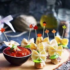 small appetizers are arranged on a cutting board