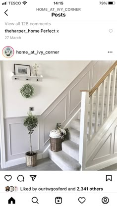 the stairs in this house have been painted white and are decorated with potted plants