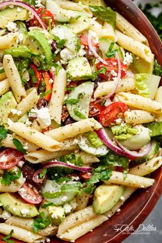 a bowl filled with pasta salad and dressing