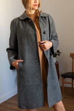 Stylish vintage coat from the 90s Lightweight with superior warmth Gray colour Small shoulder pads Side pockets Beautiful vintage buttons Excellent vintage condition Brand Indra Made in Spain Composition 100% Virgin wool Size The tag says size 46 but it fits a size L/XL (The model wears L size and is 1,75m tall)  Please check measurements before purchase Measurements Taken from seam to seam while the garment is lying flat  Shoulders: 43cm / 16,9inch Sleeves: 63cm / 24,8inch Bust: 56cm / 22inch Length: 109cm / 42,9inch PLEASE convo me if you have any further questions about this item or would like to see more pictures. I try to be as accurate as possible in the description but want you to be fully satisfied with anything you purchase! You are about to buy a vintage item. This means, the pie Gray Colour, Gray Wool Coat, Wool Winter Coat, Vintage Woman, Women Overcoat, Long Winter, Vintage Coat, Wool Coat, Favorite Outfit