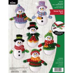 an image of snowmen with hats and scarfs on the cover of a sewing pattern