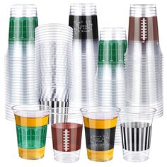 several cups with different colors and designs are stacked on top of each other in the shape of footballs