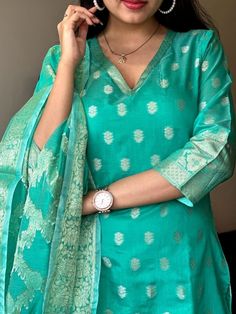 Indulge in timeless elegance with our Turquoise Chanderi Kurti Set. Crafted with pure banarsi silk jacquard and detailed with intricate self zari work, this suit is a must-have in your wardrobe. The set comes with a matching silk pant, a pure heavy banarsi self zari jacquard dupatta, and a cotton lining for added comfort. Dry clean only. Silk Suit Designs Indian, Banarasi Suit Designs, Banarsi Suit, Simple Indian Suits, Suits For Women Indian, Stitched Kurti, Cotton Suit Designs, Dress Designs For Stitching, Suit Neck Designs