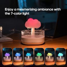 the colorful mushroom light is sitting on top of a wooden table with four different colors