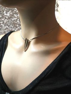 An elegant goth aesthetic fang or talon minimalist style stainless steel snake chain Necklace. This is a great Goth Necklace, Edgy Jewelry, Edgy Necklace, Chunky Jewelry, Gift for Her.  Great statement necklace that is hypoallergenic and waterproof and absolutely won't tarnish! Great for every day wear, for and edgy addition to your outfit. 21c@40pr-31p540h Metal Snake Chain Choker, Modern Metal Choker As A Gift, Modern Metal Choker As Gift, Metal Snake Chain Necklace Gift, Modern Stainless Steel Jewelry For Party, Metal Snake Chain Choker As Gift, Modern Metal Snake Chain Necklace As Gift, Trendy Metal Snake Chain Necklace As Gift, Trendy Metal Snake Chain Necklace For Gifts