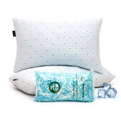 two pillows and one pillow are sitting next to each other