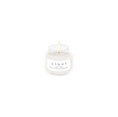 a white candle with the word light on it's front and side, against a white background