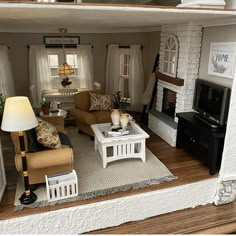 a doll house living room with furniture and accessories