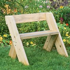 a wooden bench sitting in the grass