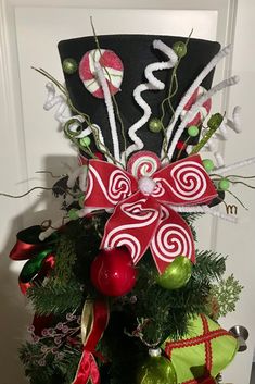 a christmas tree decorated with candy canes and ornaments