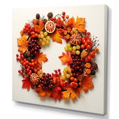 a wreath made out of autumn leaves and berries on a white background canvas wall art print