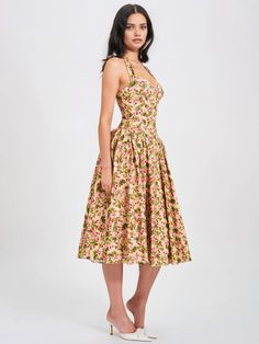 Behold our Niya maxi dress, a stunning union of style and ease. Delicately crafted from a charming floral print fabric, it exudes feminine allure with every step. The drop waist design imparts a contemporary silhouette, while padded cups ensure a flattering fit. Practicality meets elegance with convenient pockets discreetly integrated into the design. Structured with built-in bones and hard mesh supporting the hemline, it promises both form and function. Seamlessly finished with an invisible zipper, this dress is a flawless choice for any special occasion, offering both grace and sophistication. Materials: Linen Length from underarm: Approx 39 inch / 99 cm Stretch Factor: Non Stretch Clean: Dry-clean only Model Is Wearing A Size XS (US-2) Model Is 5'11'' lighting on images. The product ima Floral Midi Sundress For Daywear, Floral Print A-line Sundress For Garden Party, Printed A-line Maxi Dress For Garden Party, Floral Print Midi Dress With Fitted Bodice, Feminine Floral Print Midi Dress For Casual Wear, Fitted Floral Print Midi Dress For Dress Down, Fitted Floral Print Midi Dress For Casual Wear, Chic Floral Midi Dress With Fitted Bodice, Feminine Long Floral Dress For Garden Party