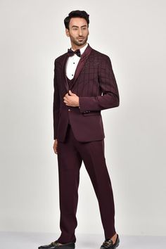 Steel wine tuxedo with bead embroidery details. Paired with a waistcoat, shirt, pant and bow.
Components: 5
Pattern: Embroidered
Type Of Work: Bead
Neckline: Lapel collar
Sleeve Type: Long
Fabric: Crepe, Handloom Silk, Terry Rayon
Color: Wine
Other Details: 
Note: Brooch and pocket square shown in the image is not for sale.
Occasion: Reception, Cocktail - Aza Fashions Burgundy Tailored Tuxedo For Formal Occasions, Elegant Burgundy Suits For Formal Occasions, Formal Burgundy Tuxedo, Elegant Burgundy Suit For Party, Elegant Burgundy Blazer For Party, Burgundy Tuxedo Suit For Formal Occasions, Elegant Burgundy Outerwear For Party, Luxury Red Evening Suits, Elegant Burgundy Party Outerwear