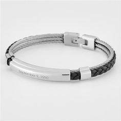 "This Genuine Leather and Steel Corded ID Bracelet will add a special touch each time it is worn! They will love the corded leather band detail and your personalized engraving on the front of the bracelet. Gift for birthdays, graduation, anniversaries, holidays, and more!  𝙉𝙤𝙩𝙖𝙩𝙚: This item is made of genuine sterling silver. Certified sterling silver is stamped or marked with \"925\". This stamp may be visible on the back or bottom of the product. It is not an engraving error and is intended to be there to show the authenticity of the product.  𝘼𝙗𝙤𝙪𝙩 𝙩𝙝𝙚 𝙄𝙩𝙚𝙢: Genuine leather polished stainless steel triple cable ID bracelet  Made of Genuine Leather and Stainless Steel Measures .3\"H x 3\"W x .3\"D Clean with a soft, slightly damp cloth Comes in velvet pouch" Classic Black Band Bracelet As Gift, Classic Bracelets With Black Band As Gift, Classic Bracelet With Black Band As Gift, Adjustable Engraved Rectangular Bracelet, Adjustable Rectangular Engraved Bracelet, Rectangular Engraved Adjustable Bracelets, Engraved Adjustable Wristband For Anniversary, Adjustable Engraved Wristband For Anniversary, Personalized Band Bracelet For Gift