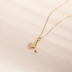 "Rhombus Urn Pendant, Real Solid Gold In 14K, Geometric Cremation Urn Necklace, Ashes Holder for Human or Pet, Diamond Shape Urn Pendant ★ D E T A I L S ------------------  ☆ Material: Solid Gold, real gold (not gold-filled or no gold-plated) ☆ Pendat Height: 6.5mm - 0.25 inches ☆ Pendant Width : 10 mm - 0.39 inches ☆ Chain type: Cable (solid link) ☆ Chain width (mm): 0.84mm, 0.95 mm ☆ Filling kit (funnel & pin) included There may be slight differences in measurements of the sizes due to handwor Gold Diamond-shaped Diamond Necklace, Gold Diamond Cut Necklace, Gold Diamond-shaped Necklace For Wedding, Gold Jewelry With Diamond Markers In 14k Gold, Yellow Gold Necklace With Diamond Cut, Formal Gold Jewelry With Diamond Markers, Formal Yellow Gold Diamond-shaped Jewelry, Gold Diamond-shaped Necklace For Anniversary, Gold Diamond-cut Diamond-shaped Necklace