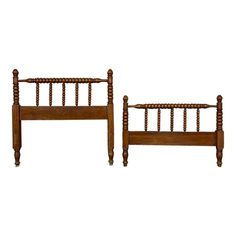 two wooden beds sitting next to each other on top of a white background with no one in it