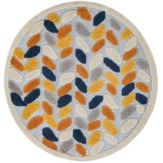 a round rug with an orange and blue design on the center, in front of a white background