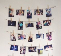 several photos hung on clothes pins with clothes pins attached to them and hanging from the wall