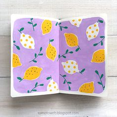 an open children's book with lemons painted on the pages and in it