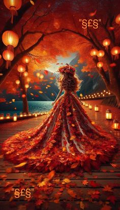 a woman in a long dress is surrounded by leaves and lanterns as she looks out over the water