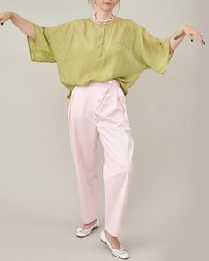 "Experience the epitome of vintage charm with our exquisite Loose Silk Top in a refreshing pistachio green hue. Crafted from pure silk, this short sleeve blouse offers a luxurious and lightweight experience, making it the ideal choice for elegant summer looks. 🍃 Lightweight Pure Silk: Indulge in the divine touch of pure silk, carefully selected for its feather-light texture. Stay cool and comfortable throughout summer days while basking in the unmatched softness against your skin. 🌸 Vintage Elegance: Embrace the allure of a bygone era with this vintage silk top. The pistachio green color exudes a sense of freshness and sophistication, adding a touch of timeless elegance to your ensemble. 👚 Women Size L: Designed to cater to women size L, this loose-fitting silk top provides a flattering Feminine Green Tops For Workwear, Chic Green Blouse For Spring, Chic Green Spring Blouse, Green Silk Blouse For Spring, Chic Khaki Blouse For Spring, Green Silk Blouse For Summer, Green Tops For Spring Daywear, Green Spring Tops For Daywear, Green Summer Blouse For Daywear