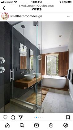 a bathroom with a tub, sink and glass shower door that opens up to the outside