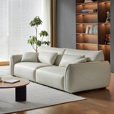 a living room filled with furniture and a book shelf next to a window covered in blinds