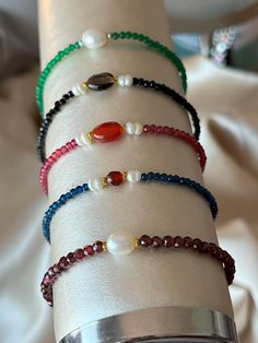 Spectacular, stylish, and colorful bracelets of green emerald, red ruby, garnet stone, blue sapphire, and natural black spinel jewelry ☀ MATERIALS ☀ ✔Ruby, emerald, sapphire stone, natural black spine and natural garnet faceted, round ✔ Real Pearl ✔ Gold and silver-plated hardware ☀ SIZE ☀ ☀Bracelets-Choker is ~15 cm (~- 6 inches)  ☀ Garnet- diameter about ~3-5 mm natural pearl in the center- oval ~7x5x3 mm ☀Ruby- diameter about ~2 mm, natural garnet in the center faceted ~8x6x3 mm ☀Emerald- dia Elegant Multicolor Pearl Bracelet With Gemstone Beads, Elegant Handmade Rondelle Beaded Bracelets, Elegant Multicolor Faceted Beaded Bracelets, Elegant Multicolor Faceted Beads Bracelets, Elegant Multicolor Bracelets With Faceted Beads, Elegant Multicolor Faceted Beads Crystal Bracelet, Elegant Multicolor Crystal Bracelet With Faceted Beads, Elegant Gemstone Beaded Bracelets For Gift, Faceted Rondelle Bracelets As Gift