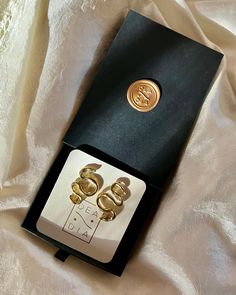 Upgrade your jewelry with our festive holiday packaging featuring sleek black jewelry boxes emblazoned with a hand-stamped gold Dea Dia wax seal. Jewelry Presentation, Hand Moisturizer, Casting Jewelry, Holiday Packaging, Holiday Jewelry, Black Jewelry, Solid Gold Jewelry, Wax Seal, Festive Holiday