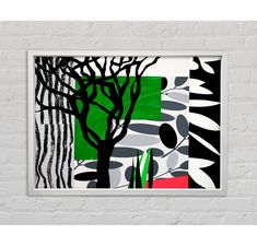 a white brick wall with a green and black painting hanging on it's side