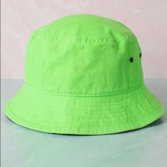 Stone Wash Neon Bucket Hat (Lime Green) Description: Foldable And Crushable Hat Unisex Condition: New With Our Boutique Tag Material: 100% Cotton Size: S/M - Approx. 21 1/8 - 21 7/8” (53.5 Cm - 55.5 Cm) 2 Inches Brim. L/Xl - Approx. 22 1/4 - 23” (56.5 Cm - 58 Cm) 2 Inches Brim. Sold Out Trendy Green Cotton Sun Hat, Casual Green Sun Hat For Spring, Green Vacation Bucket Hat, Trendy Green Brimmed Bucket Hat, Green Casual Sun Hat, Green Wide Brim Bucket Hat Casual Style, Trendy Green Bucket Hat For Spring, Green Casual Bucket Hat With Short Brim, Casual Green Bucket Hat With Short Brim