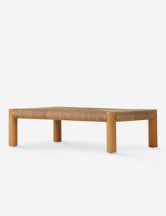 a wooden bench sitting on top of a white floor