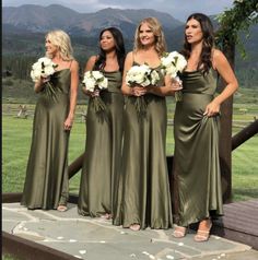 the bridesmaids are all dressed in olive green dresses