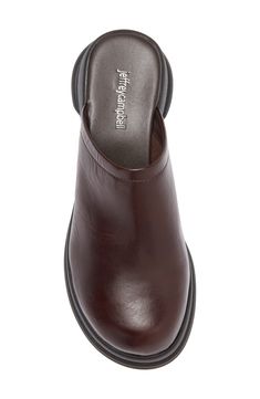 A sculpted rubber sole enhances the cushioned comfort of this shapely clog constructed from smooth leather. 2" heel; 3/4" platform (size 8.5) Leather upper and lining/rubber sole Imported Heeled Clogs, Brown Block Heel Clogs With Leather Sole, Brown Leather Clogs Medium Width, Brown Slip-on Clogs With Leather Sole, Leather Clogs With Heel Loop, Medium Width, Vintage Clogs, Brown Leather Clogs With 4-inch Heel, Brown Clogs, Black Clogs