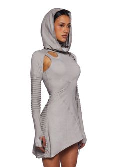 in a stretch jersey construction with cut out detailing. An attached hood with an integrated turtleneck design, pintuck long sleeves with thumbhole cuffs, lace ups on one arm, an asymmetrical hem, and an embroidered “D” on the back. Hooded Outfits Women, Ancient Futurism, Futuristic Fashion Women, Fashion Cyberpunk, Futuristic Outfits, Cyberpunk Outfit, Dress With Hood, Dark Circus