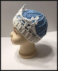 a crocheted hat on top of a mannequin head