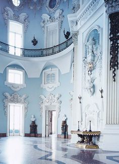 an ornately decorated room with blue walls and ceilings