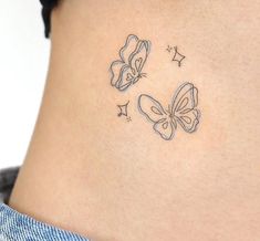 a woman's stomach with two butterflies on it