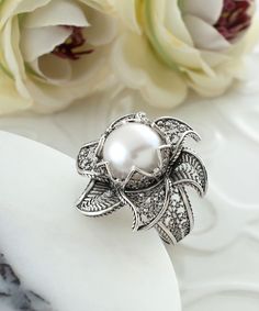 Flower Shaped Pearl Ring For Wedding, Elegant Flower Ring With Intricate Design, Elegant Silver Flower Shaped Ring, Elegant Silver Flower Ring For Gift, Silver Elegant Flower Ring For Gift, Elegant Silver Diamond Flower Ring, Elegant Filigree Flower Ring For Formal Occasions, Elegant Flower Ring With Intricate Design As Gift, Elegant Formal Flower Ring With Intricate Design